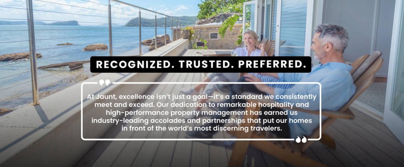 Couple sitting on patio with beach view